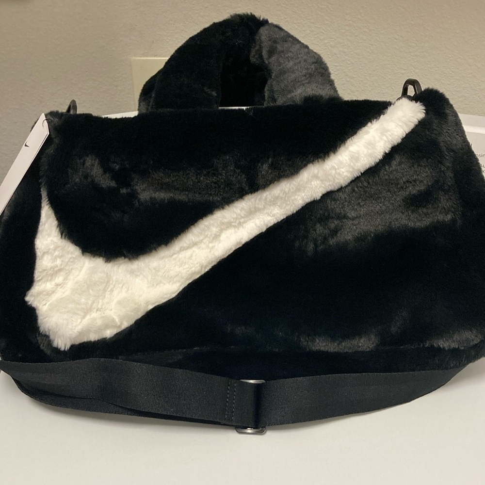 Nike Black and White Travel Bag with Iconic Swoosh